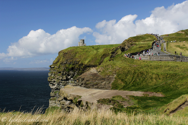 Tourists line the Cliffs of Moher