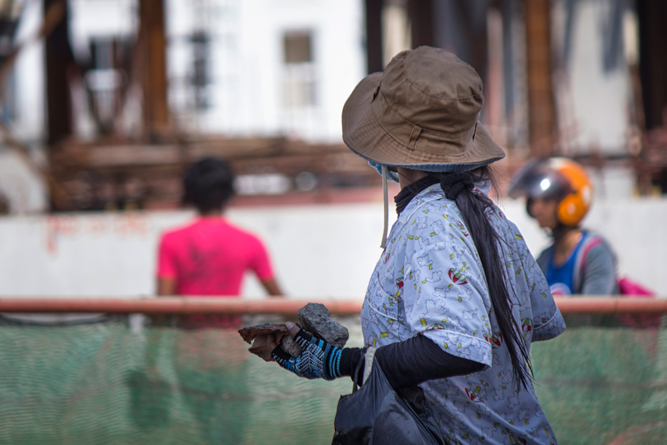 A protester carries rocks to the protest