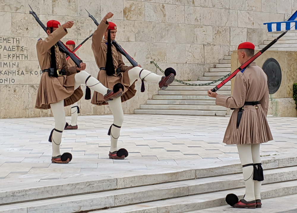 Athens guards kick their legs during the changing of the guard ceremony in Athens