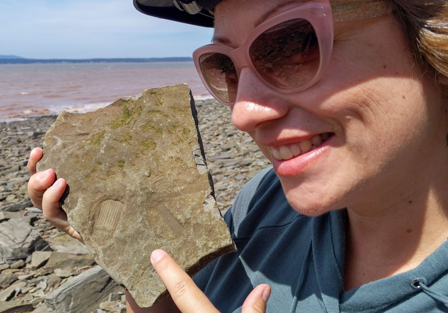 On the beach Dalene is finding fossils in Joggins, Nova Scotia