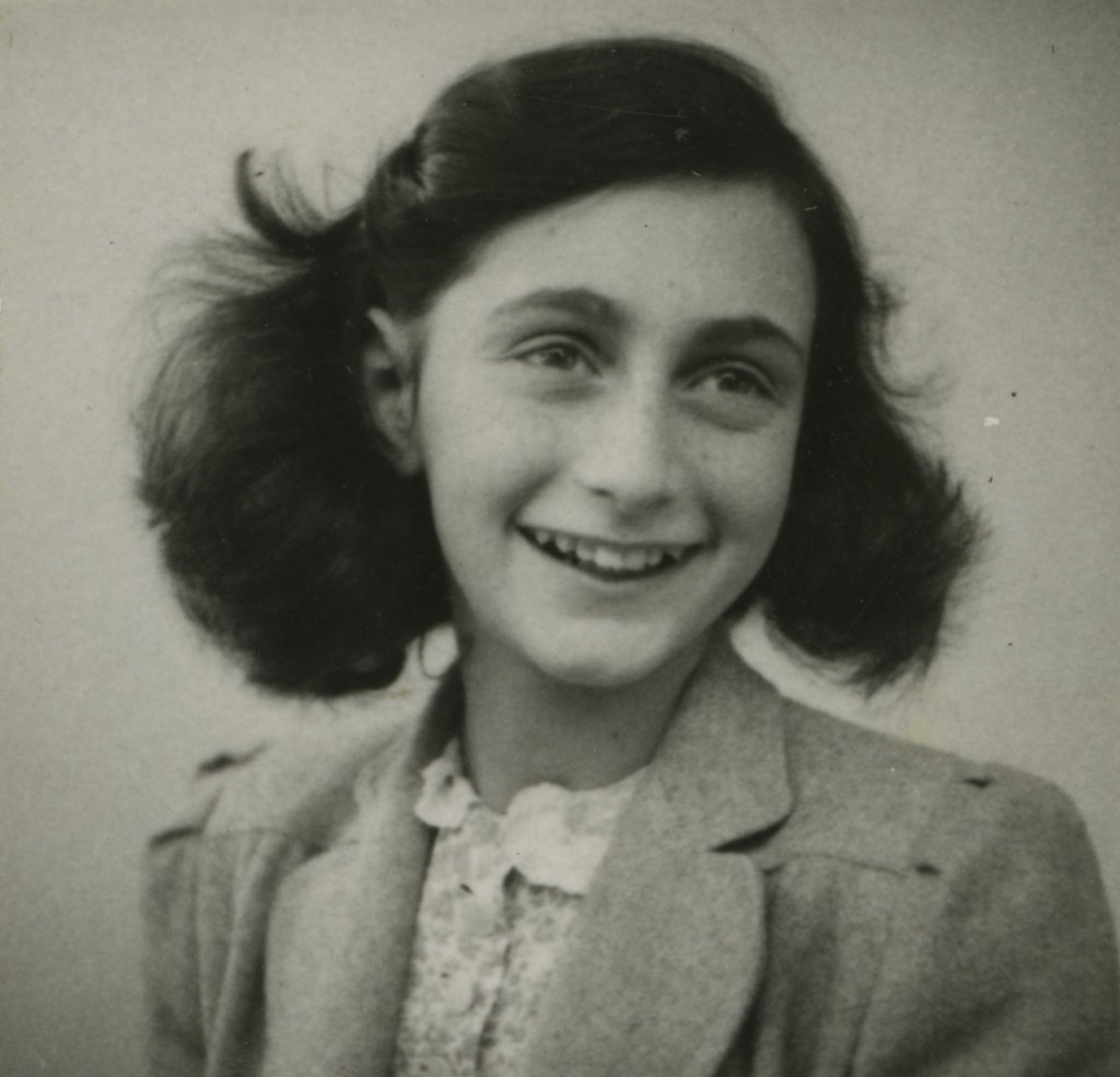 Anne Frank portrait black and white smiling